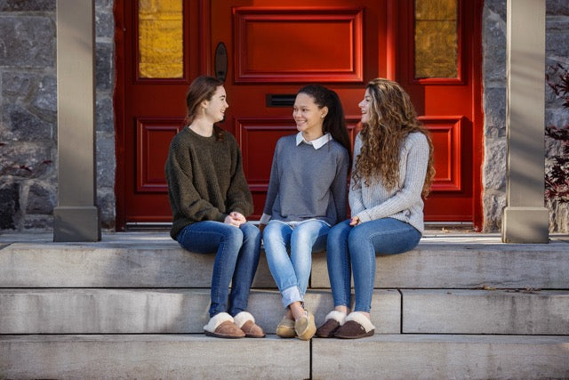 3 friends wearing cozy Nuknuuk Slippers